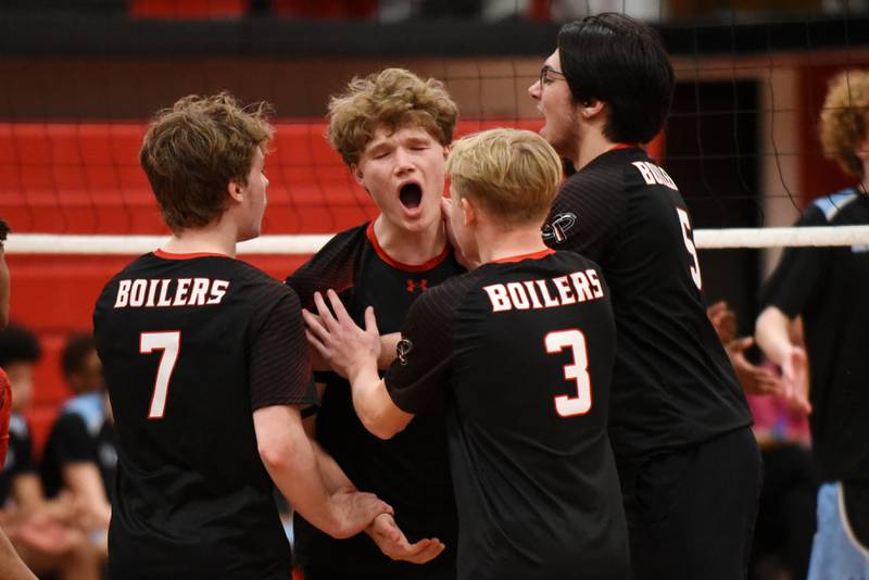 Members of the Bradley-Bourbonnais boys volleyball team celebrate a point during a home game against Kankakee Thursday, April 9, 2026.