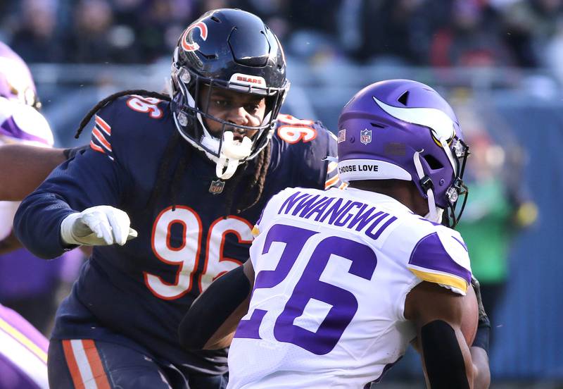 Chicago Bears defensive tackle Armon Watts lines up Minnesota Vikings running back Kene Nwangwu Sunday, Jan. 8, 2023, during their game at Soldier Field in Chicago.