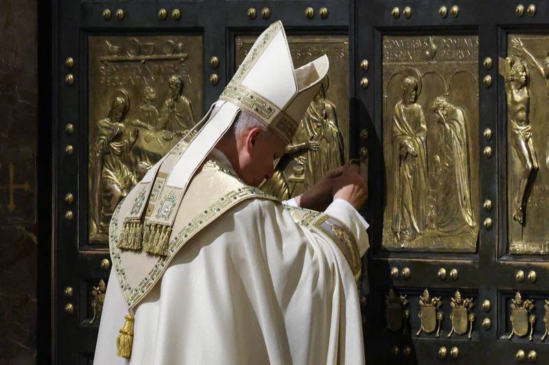 Pope Leo XIV closes St. Peter's Basilica Holy Door to end the 2025 ordinary Jubilee year, at the Vatican, Tuesday, Jan. 6, 2025. (Yara Nardi/Pool photo via AP)