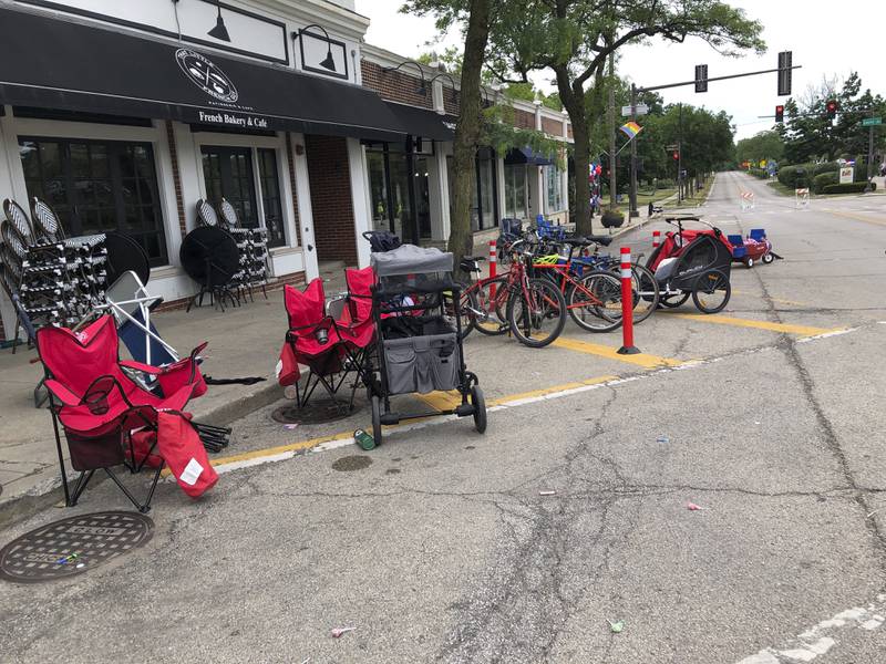 Terrified parade-goers fled Highland Park's Fourth of July parade after shots were fired, leaving behind their belongings as they sought safety, Monday, July 4, 2022, in Highland Park, Ill. (Lynn Sweet/Chicago Sun-Times via AP)