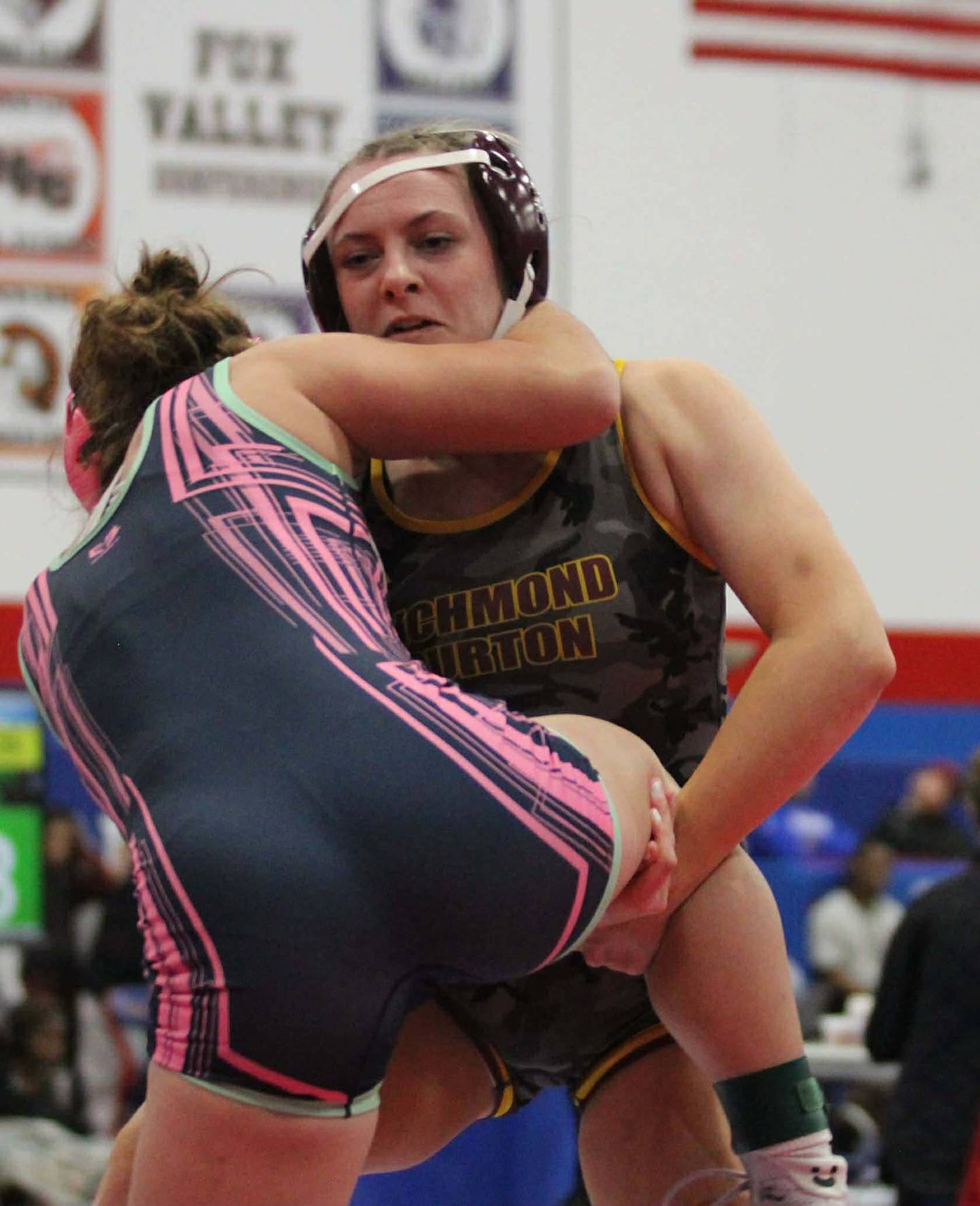 Richmond-Burton's Madelyn Peterie goes for a takedown during varsity action earlier this season.