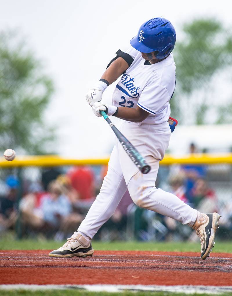 St. Francis’ lan Bagaconza hits the ball against Benet Academy during the Class 3A Kaneland Sectional final at Kaneland High School in Maple Park on Saturday, June 7, 2025.