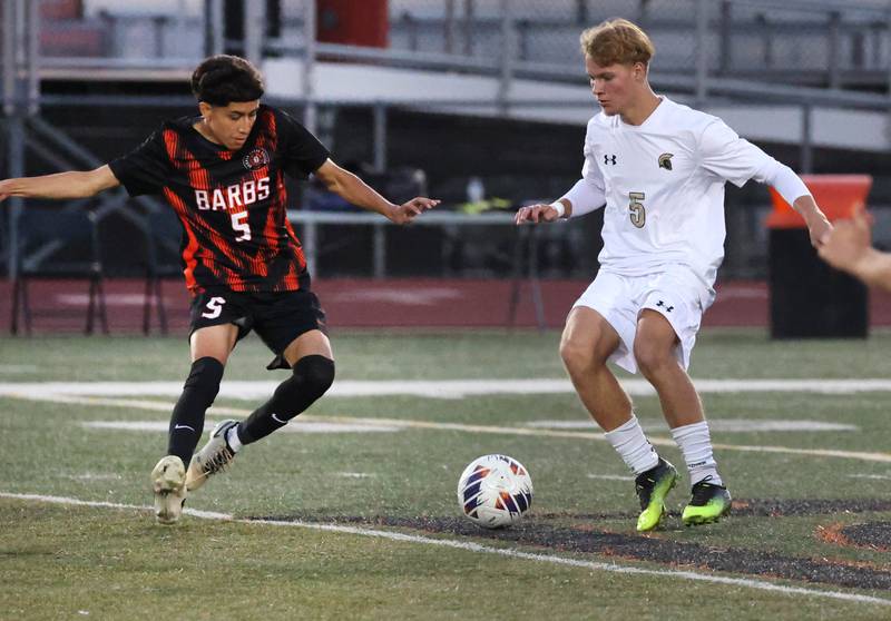 DeKalb's Erick Talamantes (left) and Sycamore's Aiden Sears go after the ball during their game Thursday, Oct. 10, 2024, at DeKalb High School.