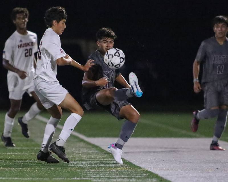 Morton's Jonathan Almaguer (10) heads the ball during soccer match between Naperville North at Morton.  Sept 21, 2023.