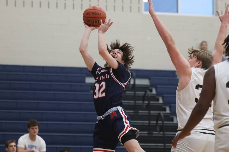 St. Viator’s Ryan Jackson finesses a shot against Joliet Catholic.