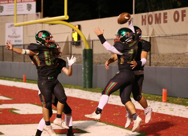 L-P's Brady Romagnoli celebrates with teammates as he scores a touchdown over Ottawa on Friday, Oct. 6, 2023 at Howard Fellows Stadium.