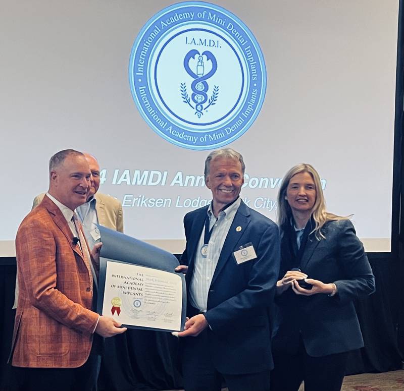 Dr. Mark Wienhold (right) is recognized for achieving the status of Diplomate within the International Academy of Mini Dental Implants.