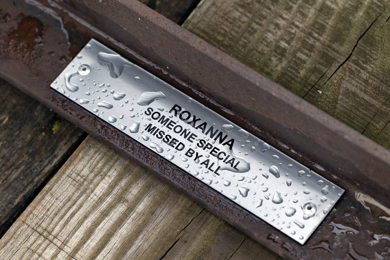 One of the name plates on a repaired plank seen on Thursday, July 30, 2025.