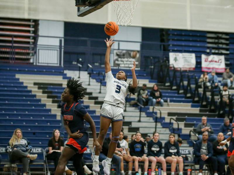 Oswego East's Avaya Kittling-Turner (3) puts in a late basket during their basketball game between Oswego at Oswego East, Feb 10, 2026 in Oswego.