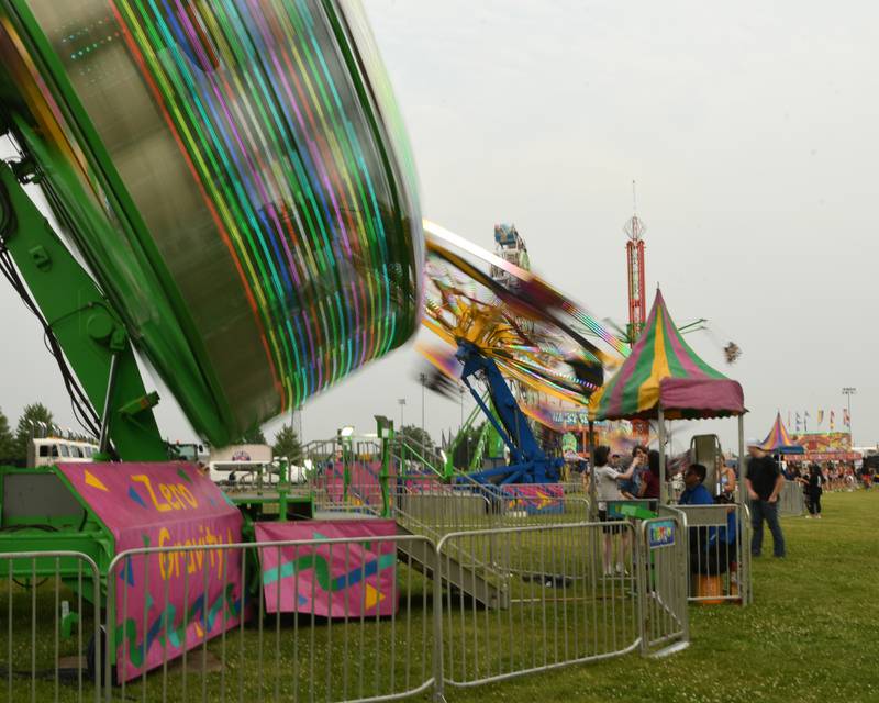 Community members enjoy the fire ball ride on Thursday June 12, 2025, during PrairieFest held at PrairieFest Park in Oswego.