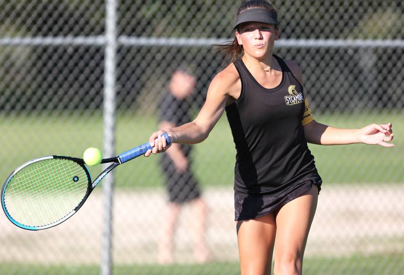 Sycamore's Abby Golembiewski hits a forehand during a doubles match against DeKalb Monday, September 19, 2022, at Sycamore High School.