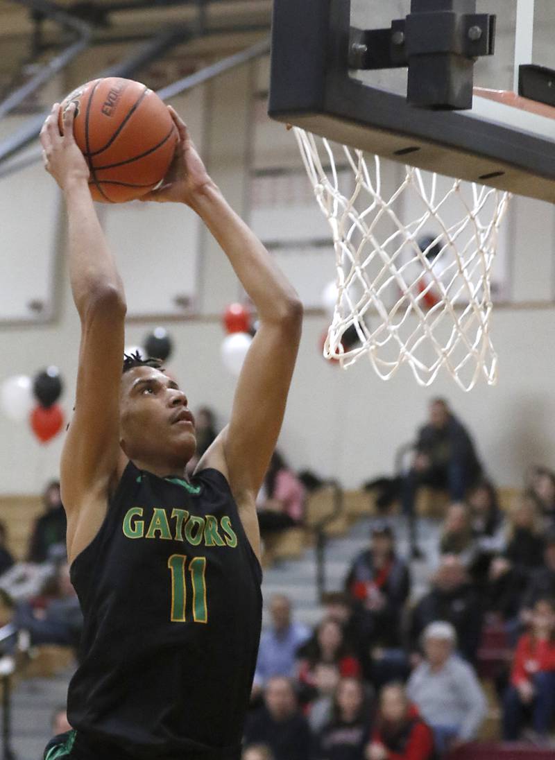 Crystal Lake South's Christian Rohde ducks the ball during a Fox Valley Conference boys basketball game against Huntley on Tuesday, Feb.6, 2024, at Huntley High School.