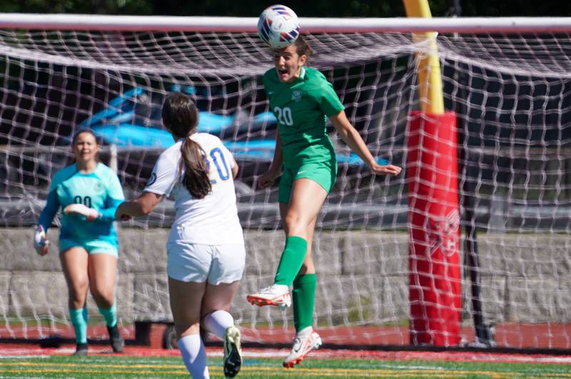 York’s Mia Barton (20) goes up for a header against Lyons during a Class 3A Hinsdale Central Sectional girls soccer championship match at Hinsdale Central High School on Saturday, May 25, 2024.