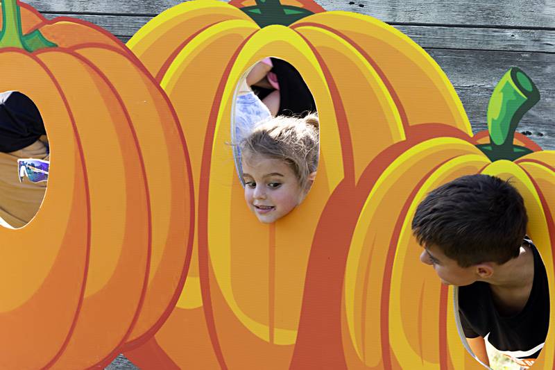 Shae (left), 4, and Logan Russell, 8, of Rock Falls pose for photos Saturday, Sept. 30, 2023 at the Pumpkin Dash. Along with the running events, families were treated to food, music, bouncy houses and a petting zoo.
