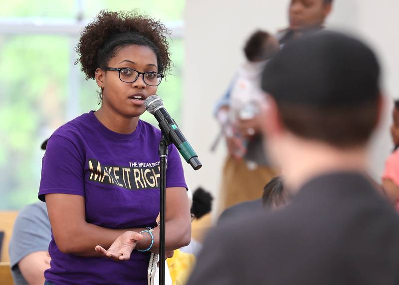 Malia James, from DeKalb, asks a question of Clint-Michael Reneau, vice president for student affairs at Northern Illinois University, after he spoke about the proposed NIU Center for Greek Life during the informational meeting Thursday, May 18, 2023, at New Hope Missionary Baptist Church in DeKalb. The meeting centered on the the proposed plans for the vacant lot on the corner of Blackhawk Road and Hillcrest Drive in DeKalb.