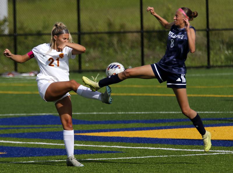 Richmond-Burton's Blake Frericks kicks the ball as \w18\ flies towards her during an IHSA Class 1A Cristo Rey St. Martin Sectional semifinal girls soccer match on Tuesday, May 26, 2026 at Cristo Rey St. Martin College Prep, in Waukegan.