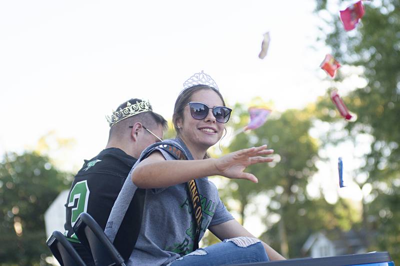 Rock Falls homecoming queen Emily Garcia and king Aidan Kobbeman throw out candy along the parade route Thursday, Sept. 22, 2022.