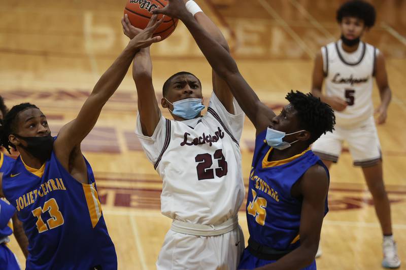 Lockport’s Khari Carpenter gets the basket and the foul against Joliet Central. Monday, Jan. 31, 2022 in Lockport.