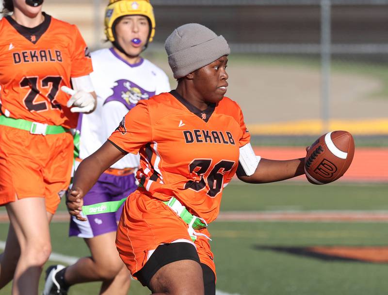 DeKalb's Angela Gary carries the ball for a touchdown Monday, Aug. 25, 2025, during their game against Belvidere at DeKalb High School. The contest marked the first ever game for the girls flag football program at DeKalb.