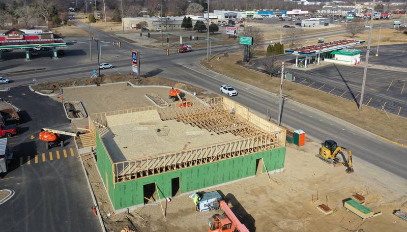 Crews build the top and sides of Jersey Mike's Subs on Monday, Feb. 23, 2026 in Princeton.