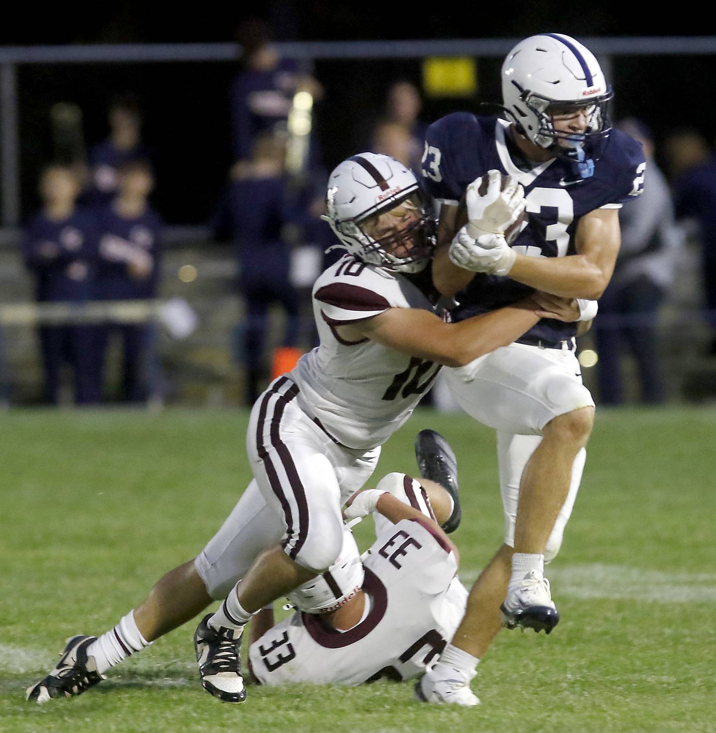 Cary-Grove's Lance Moore is tackled by Prairie Ridge's Owen Satterlee during a Fox Valley Conference football game on Friday, Aug. 29, 2025, at Cary-Grove High School in Cary.