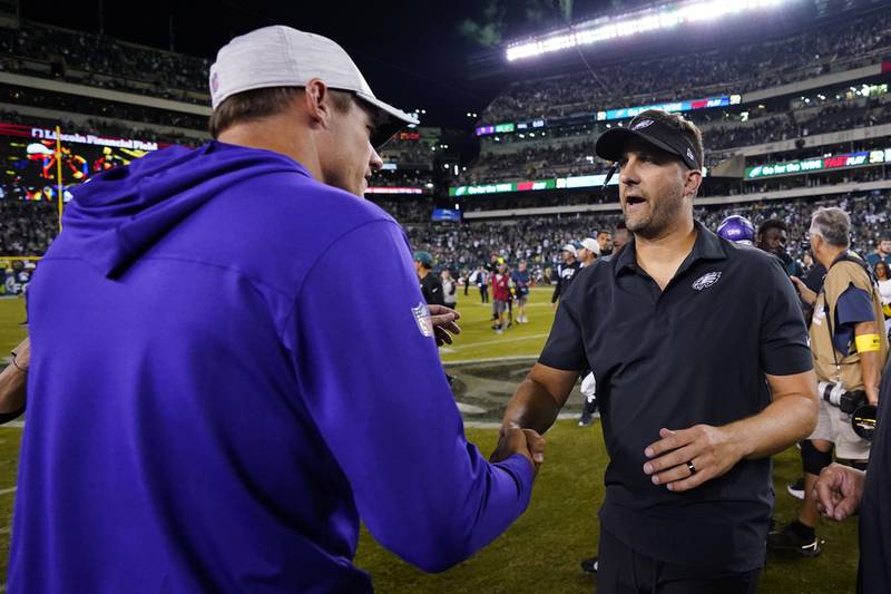 Minnesota Vikings head coach Kevin O'Connell, left, greets Philadelphia Eagles head coach Nick Sirianni after an NFL football game, Monday, Sept. 19, 2022, in Philadelphia. The Eagles won 24-7. (AP Photo/Matt Slocum)