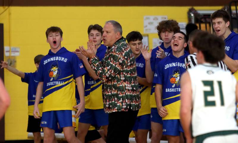 Johnsburg’s coaches and players get revved up as the Skyhawks score against Boylan in varsity boys basketball Hinkle Holiday Classic action on Tuesday, Dec. 23, 2025, at Jacobs High School in Algonquin.