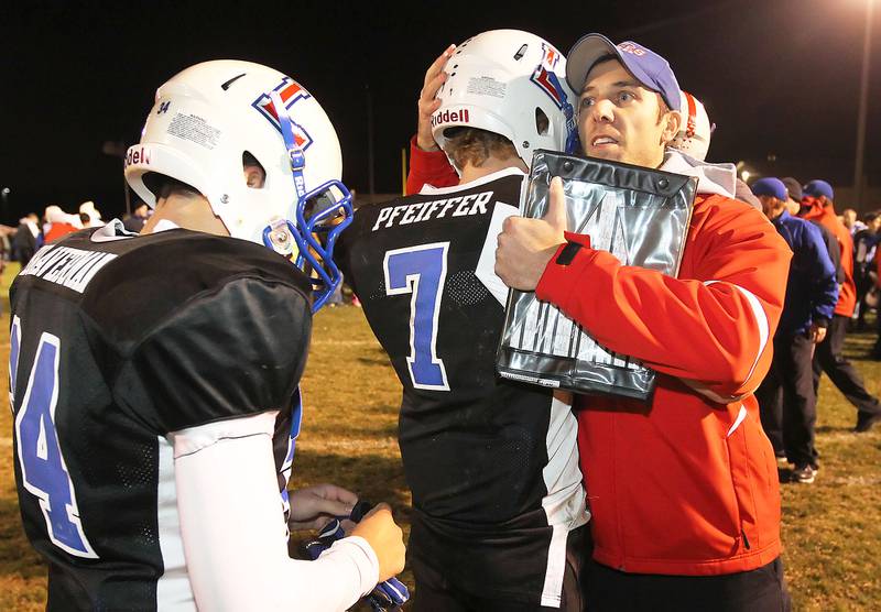 Lakes seniors Trevor Braverman and Michael Pfeiffer share a moment with head coach Luke Mertens after losing to Batavia 42-0 in the Class 6A quarterfinals at Lakes on Nov. 12.  For more photos from the game, see page 27. (Candace H. Johnson - lcjedit@lakecountyjournal.com)