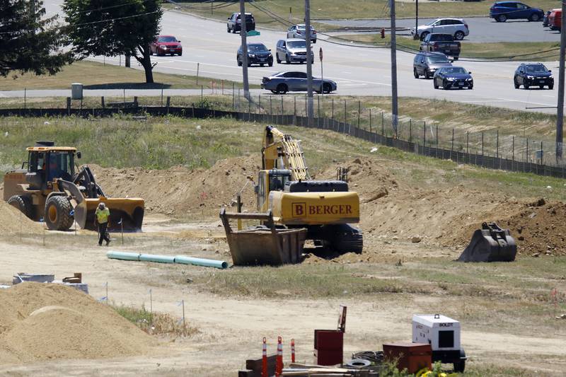 Construction equipment is seen at work during a ground breaking ceremony for a new Mercyhealth hospital at the intersection of Three Oaks Road and Rt. 31 on Wednesday, June 16, 2021 in Crystal Lake.