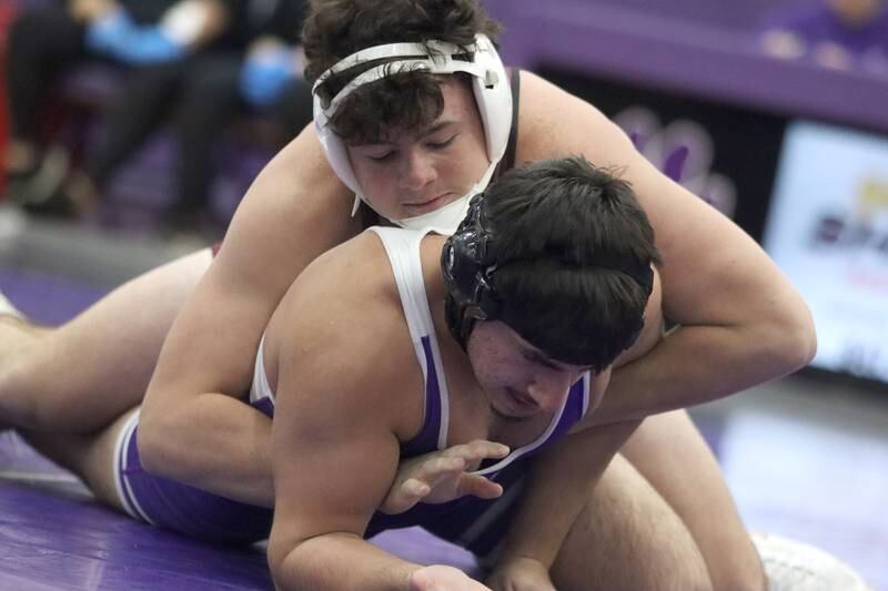 Hampshire’s George Talia, bottom, battles Prairie Ridge’s Frank Matviychuk at 190 pounds in varsity wrestling on Thursday, Dec. 5, 2024 at Hampshire High School in Hampshire.