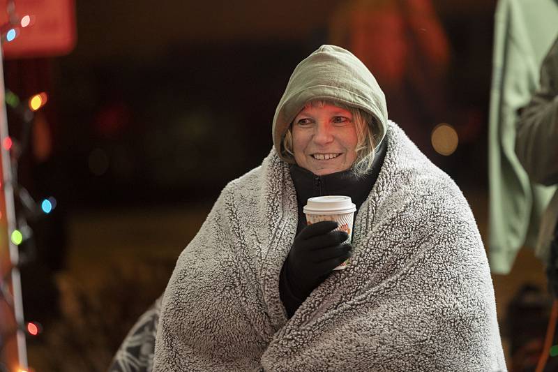 Lori Miller of the Lee County Sheriff Department came prepared for manning a booth Friday, Dec. 5, 2025, in the chilly Dixon Christmas Walk weather. Armed with a blanket, hoodie and hot cocoa, Miller was ready for the long haul.