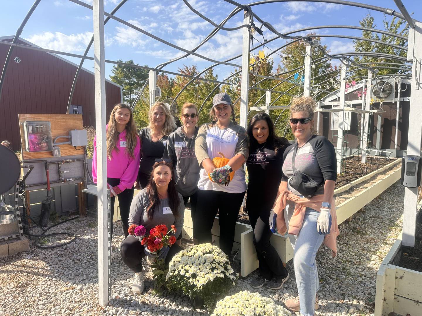 Members of the St. Charles Women's Club volunteer at the Ruth Project Farm in Sycamore.