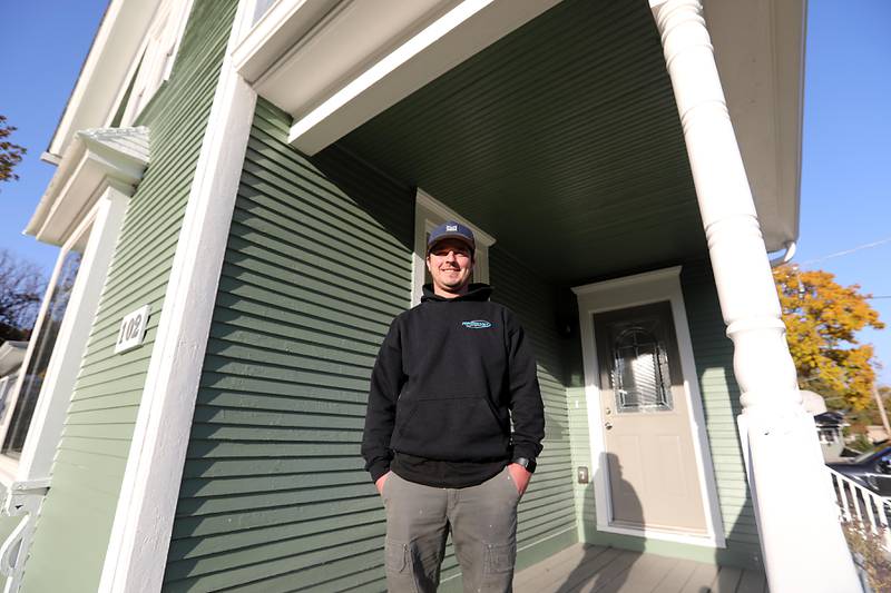 Matt Mosur on the front porch of a historic home that he recently renovated on Tuesday, Nov. 4, 2025 the home is locates at 102 Center Street, in Algonquin.