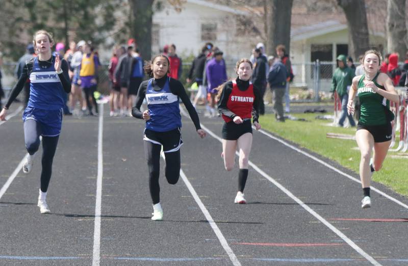 From left: Newark's Megan Williams and teammate Kiara Wesseh race with Streator's Abby Pierce and St. Bede's Anna Lopez in the 100 meter dash during the Rollie Morris Invite on Saturday, April 16, 2022 at Hall High School in Spring Valley.