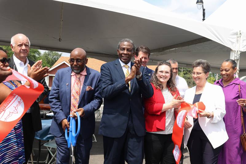 Theodis Pace, center, applauds after helping to officially cut the Kankakee Chamber of Commerce ribbon during the West Harbor Residences ribbon cutting and street dedication ceremony on Wednesday, July 23, 2025.