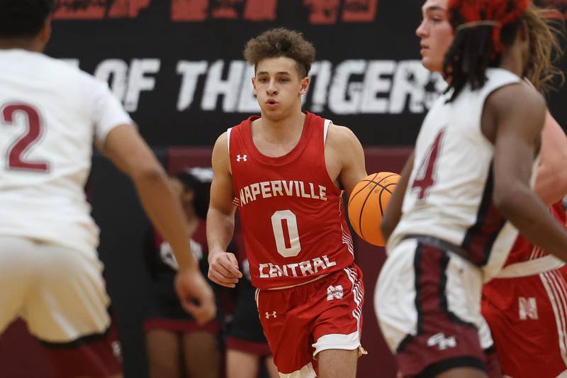 Naperville Central’s Alex Liabo works the ball upcourt against Plainfield North on Wednesday, Jan 22, 2025 in Plainfield.