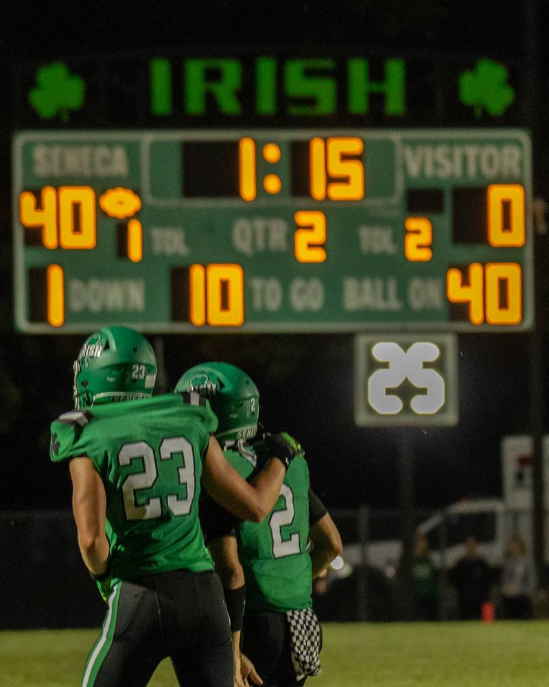 (fro left) Brady Sheedy (33) of Seneca puts arm on shoulder of teammate Gunner Garland (2) as he limps off field on Friday, Aug 29, 2025 at Seneca High School in Seneca.