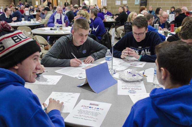 Members of Newman High School's Class of 2019 work on an answer Saturday during the Stupor Bowl.