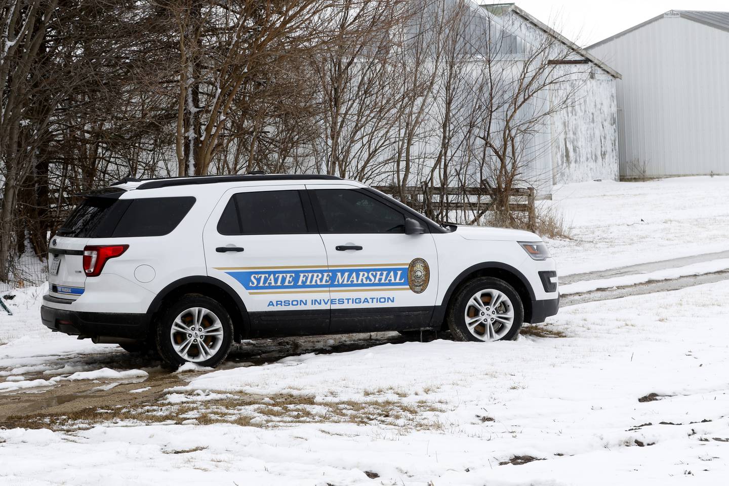 An Illinois State Fire Marshal arson investigation unit at the scene of a fire Monday, March 7, 2022, on Fleming Road in Boone County.