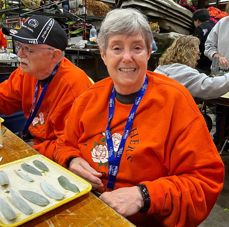 Oregon resident Lorretta Sigler helping decorate floats for the 2023 Tournament of Roses Parade