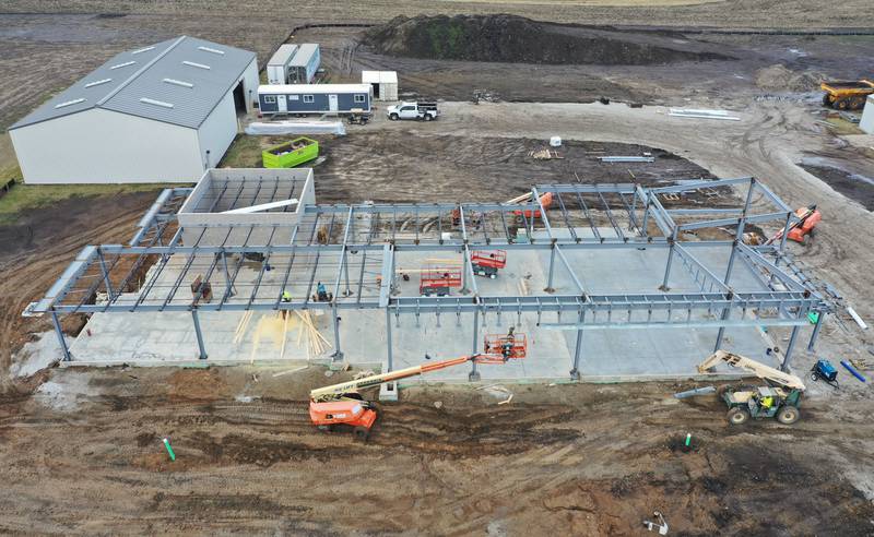 An aerial view showing crews building the exterior shell of the Dr. Alfred E. Wisgoski Agricultural Education Center on Tuesday, Jan. 13, 2026 on the southern part of Illinois Valley Community College campus in Oglesby. Last August, IVCC officially broke ground on the $7.6 million Dr. Alfred E. Wisgoski Agricultural Education Center. The 10,250-square-foot facility is expected to open in 2027. The project is supported by a $3.5 million grant from the U.S. Department of Economic Development Administration, a $240,000 grant from the Illinois Department of Commerce and Economic Opportunity and a $1 million gift from the Wisgoski family.