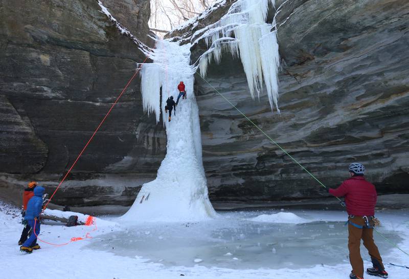 Joel Taylor of Tulsa Okla. and Gerry Voelliger of Bettendorf Iowa, descent a 35-foot frozen waterfall in Ottawa Canyon at Starved Rock State Park on Friday, Jan. 19, 2024 in Starved Rock State Park. The waterfalls tend to freeze for a brief time during January at the State Parks.  Climbers need to sign in & out at the front of the Park Maintenance Building across from the Visitor Center. Climbing is only allowed in 4 canyons at the park.