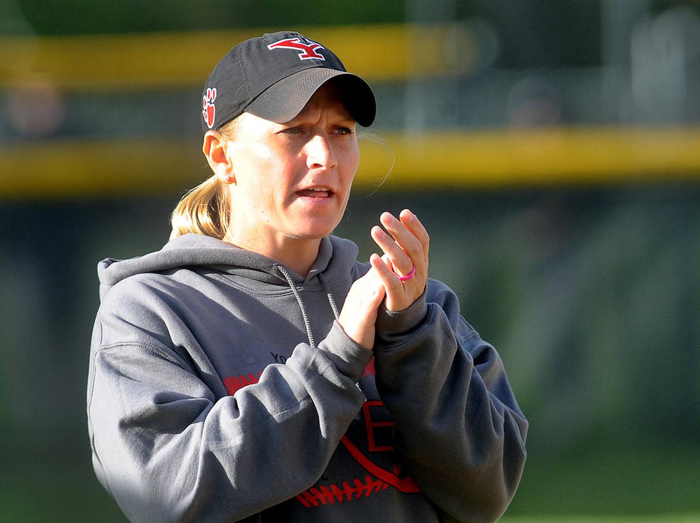 Yorkville head coach Jory Regnier cheers on her batter during a varsity softball game agasint Kaneland at Yorkville High School on Thursday, April 20, 2017.