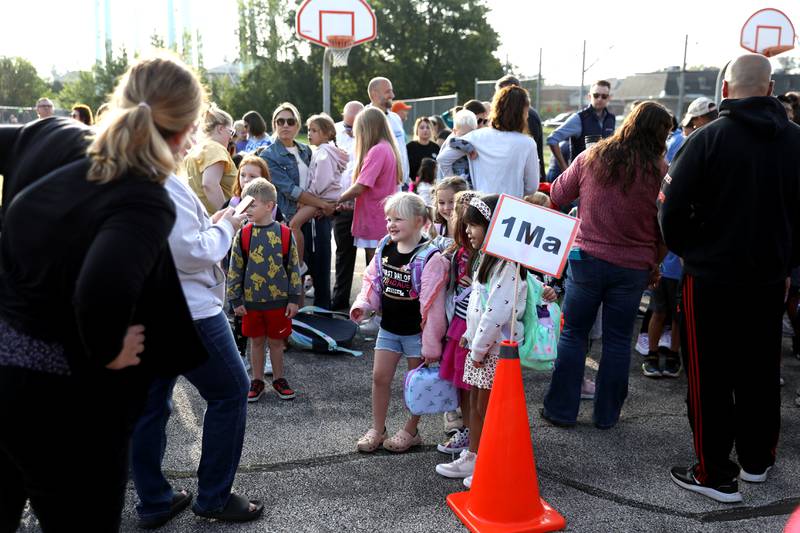 First graders line up on the first day of school Thursday, Aug. 22, 2024 at Harrison Street Elementary School in Geneva.