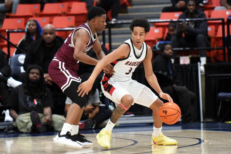 Bolingbrook's Davion Thompson, right, looks to back down Kankakee's Myair Thompson during Saturday's game at the Chicago Elite Classic at University of Illinois-Chicago's Credit Union 1 Arena.