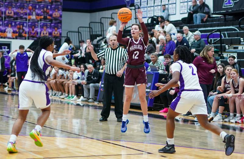 Marengo’s Gabby Gieseke (12) shoots a three pointer against Plano during a basketball game at Plano High School on Wednesday, January 29, 2025.