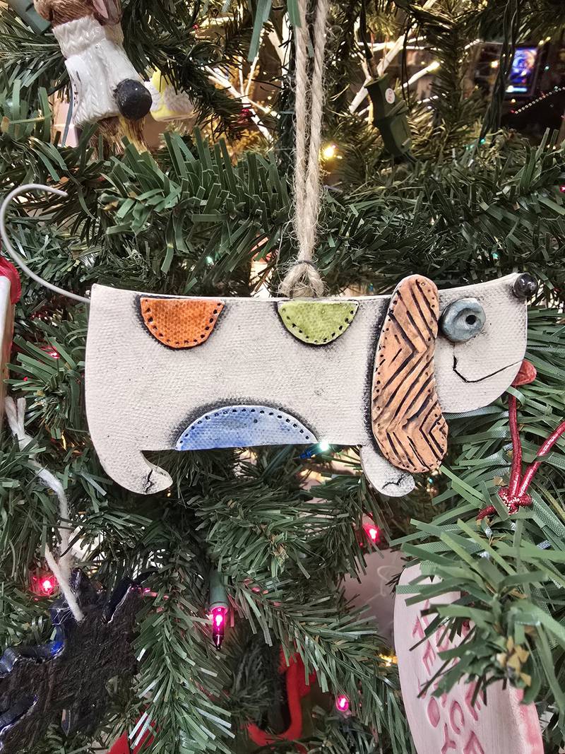 Janell Mayer has handcrafted ornaments and some holiday "uggles" for sale at the Artisans on Main in Woodstock.