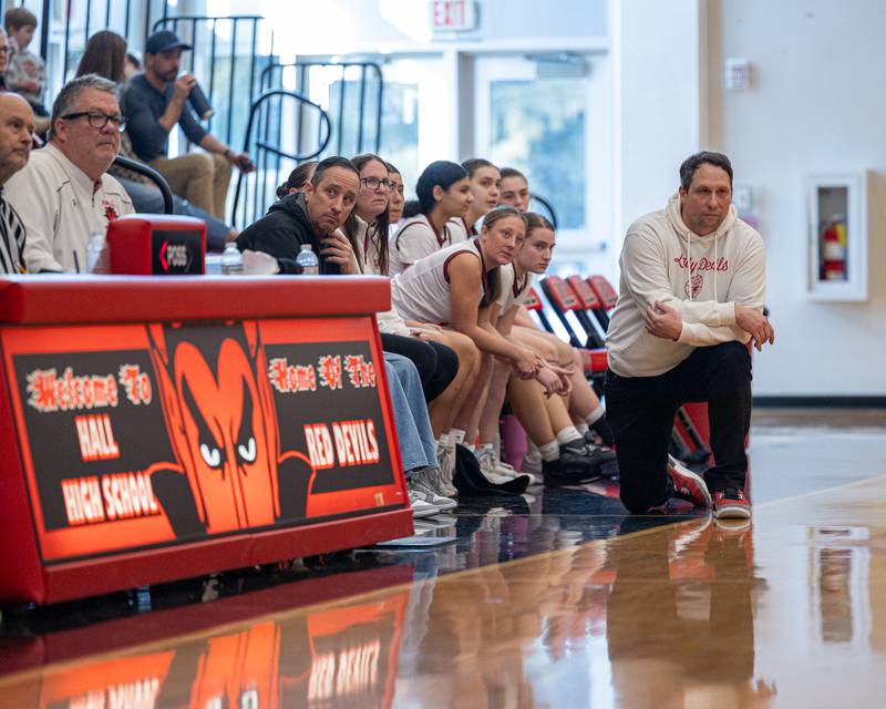 Hall Head Coach TJ Orlandi kneels on sideline whilst watching game on Saturday, January 31, 2026 at Hall High School in Spring Valley.