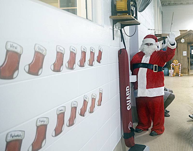 Santa gives one last wave before heading back to work Thursday, Dec. 14, 2023 after his stop at the Dixon YMCA.