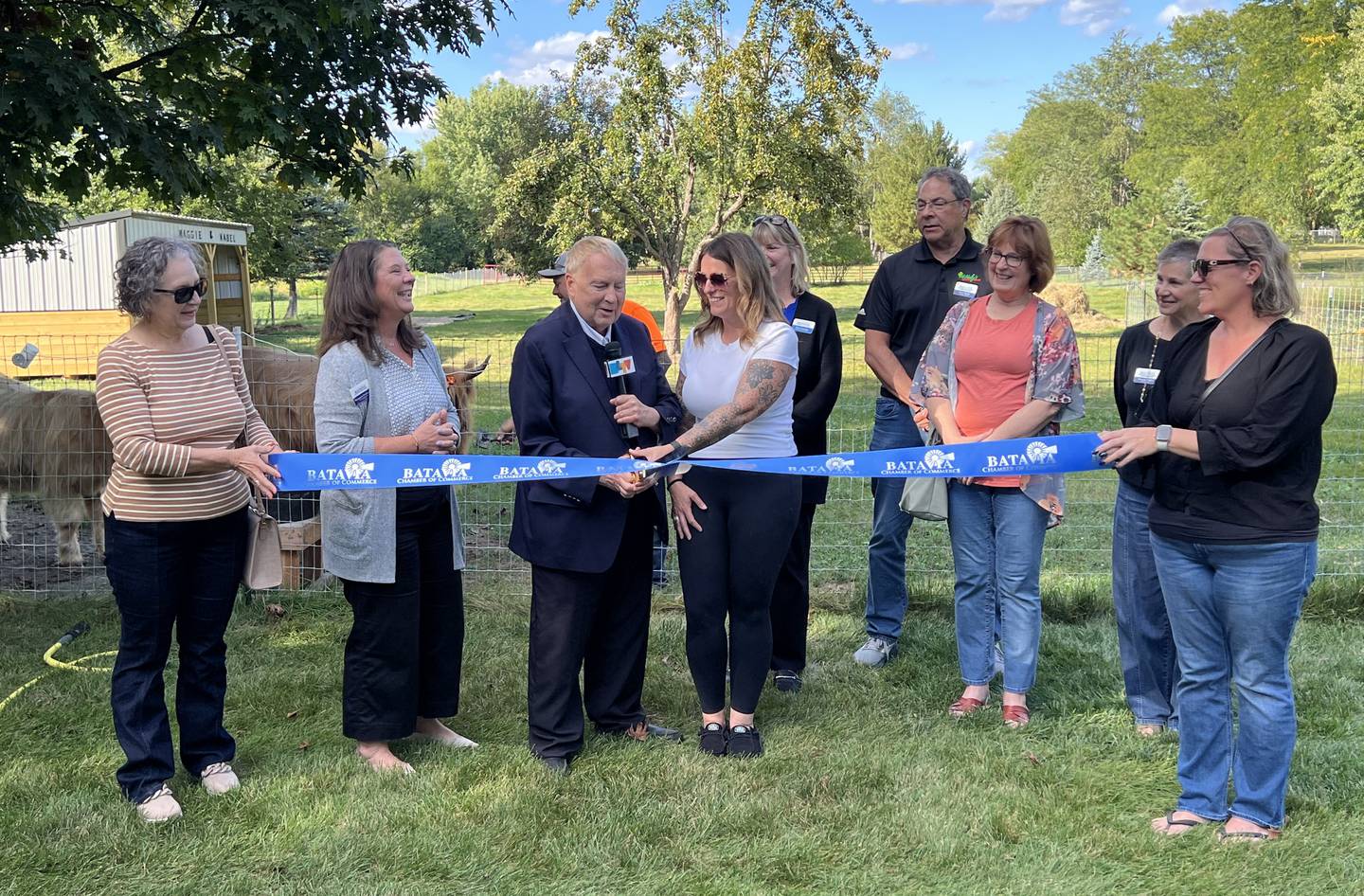 Batavia Chamber of Commerce officials and business staff pose for a photo during a ribbon cutting at Majestic Highlands Homestead of Batavia on Sept. 25, 2025.